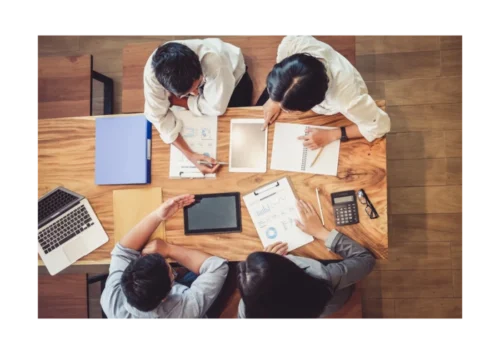 A group of employees discussing together