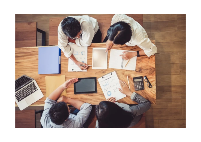 A group of employees discussing together