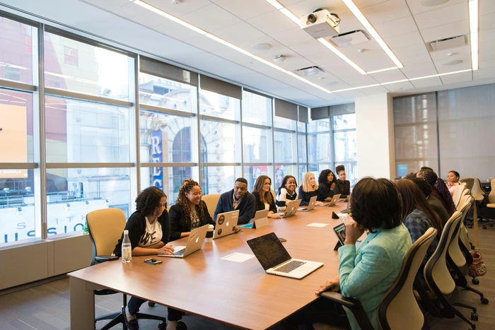 a group of business people inn a meeting