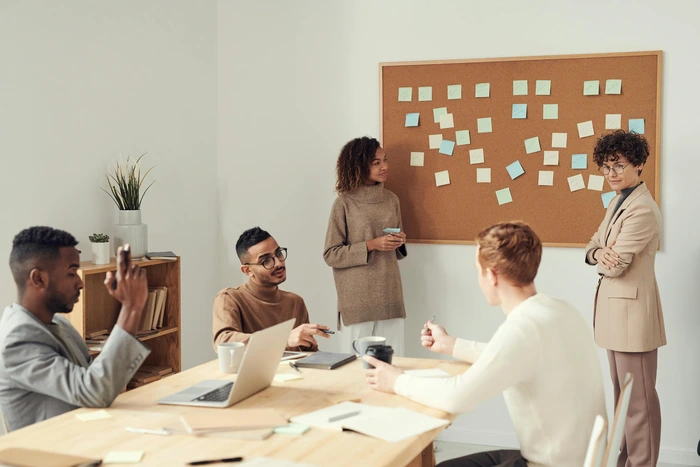 group of employees strategizing