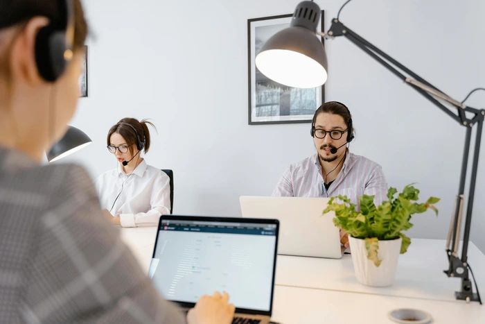 busy working people with laptop and headset