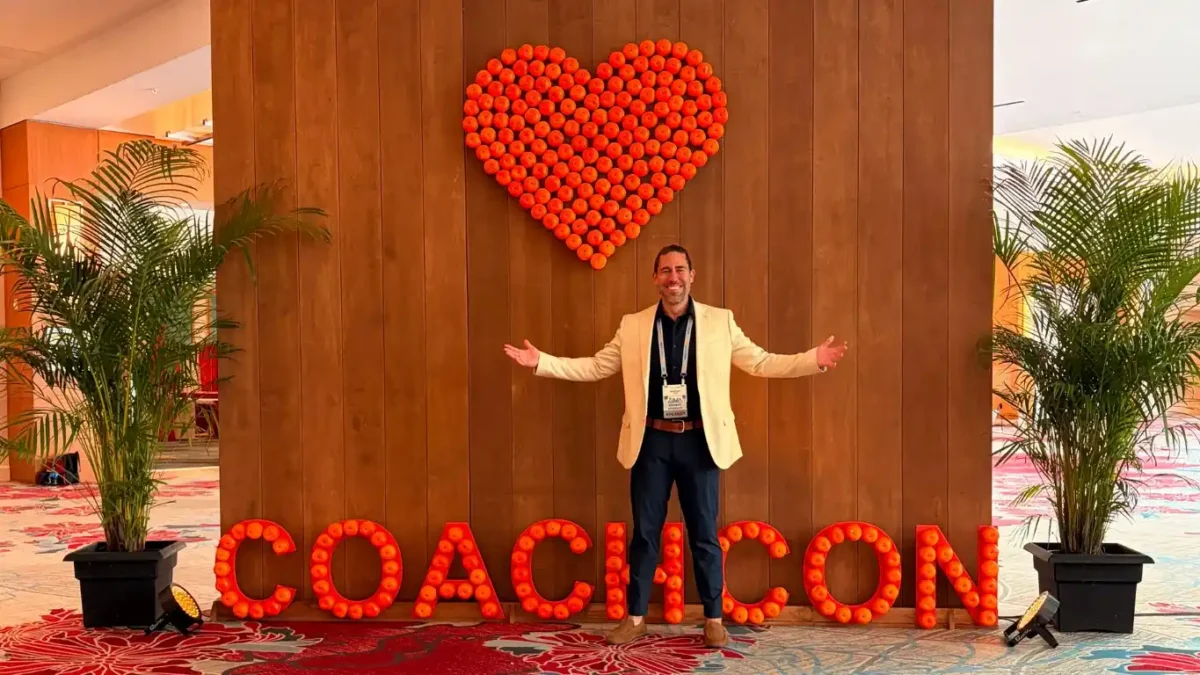 Anthony Rice at CoachCon 2026 entrance display.