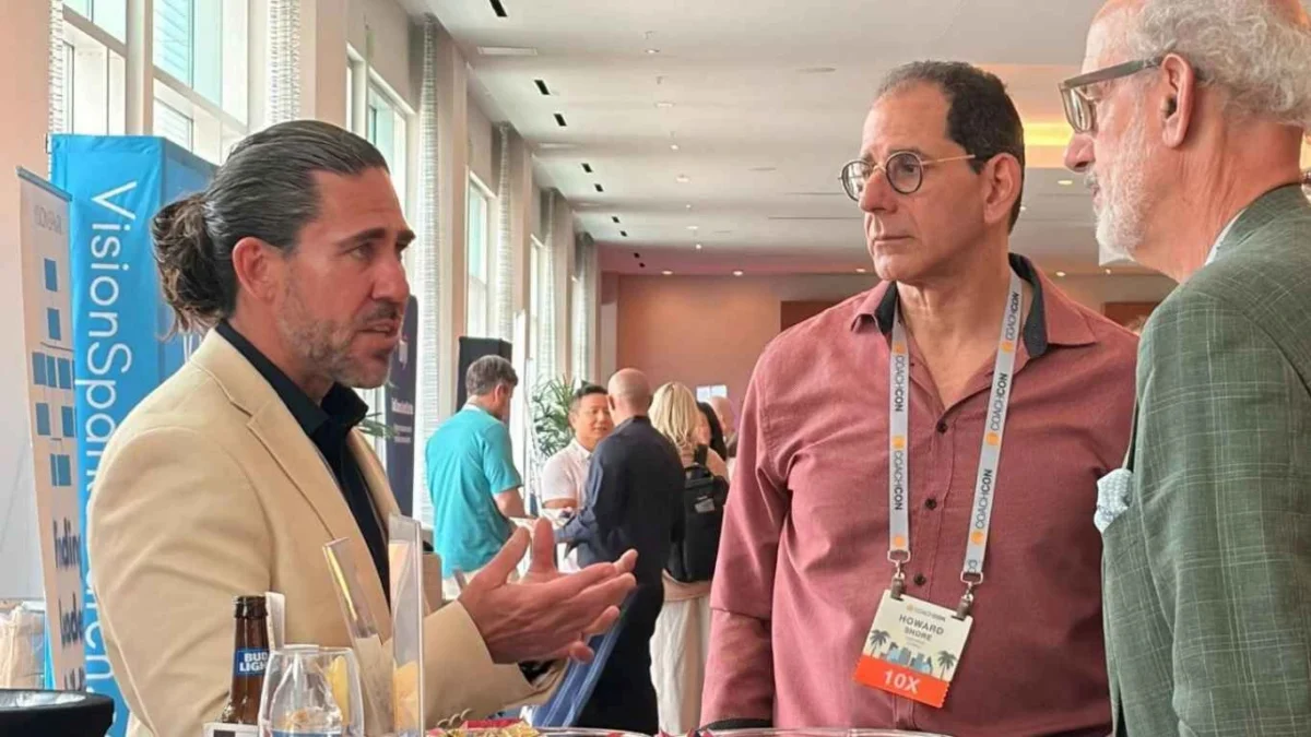 Anthony Rice networking with attendees at CoachCon 2026.