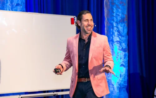 Anthony Rice on stage giving a presentation
