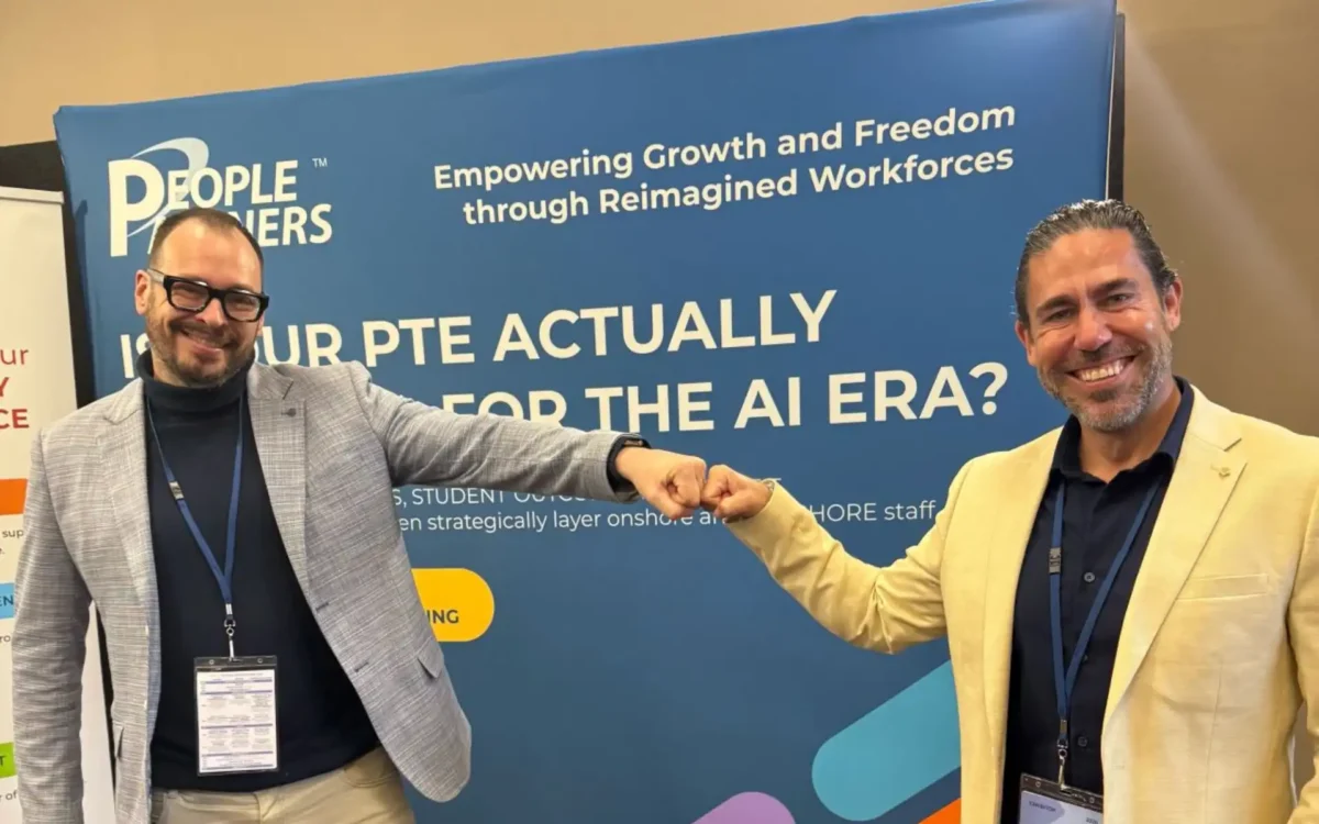 PeoplePartners booth with Anthony Riice and conference attendee