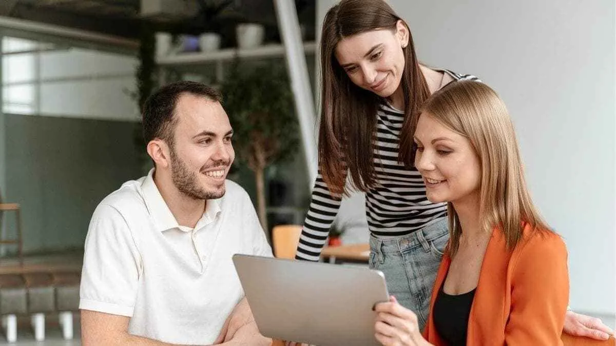 three individuals in a collaborative work
