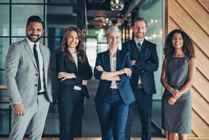 Group of five well-dressed professionals