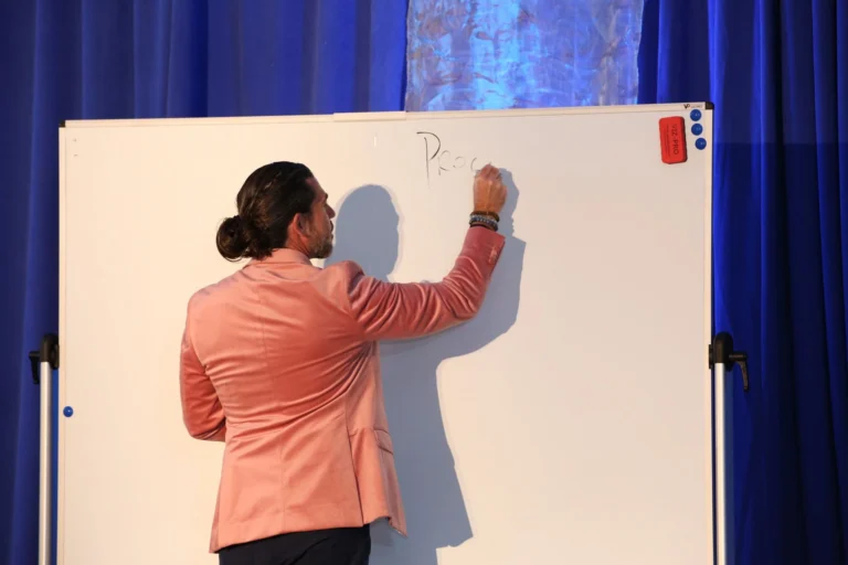 Anthony Rice writing on the whiteboard